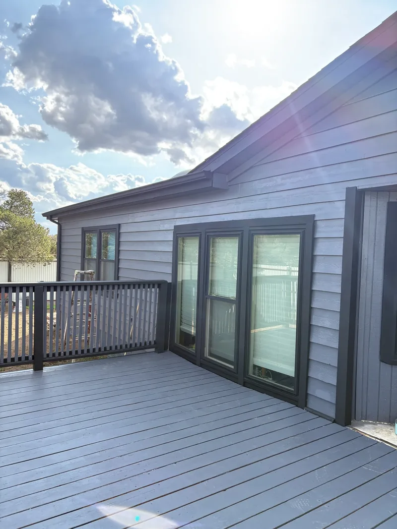 Weathered cedar deck power washed, sanded, and re-stained