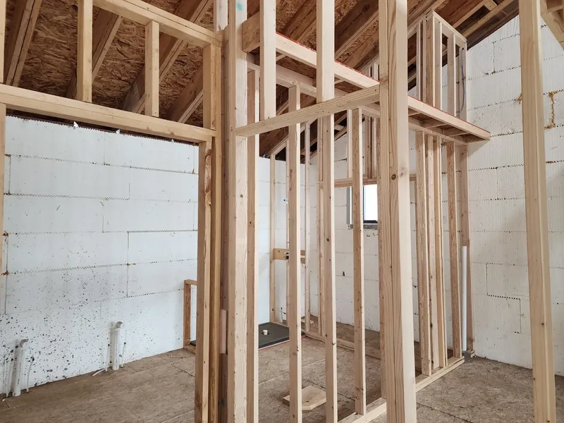 Drywall panels set on new framing during a remodel
