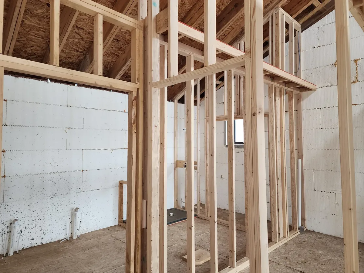 Drywall panels set on new framing during a remodel