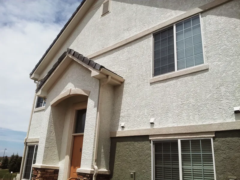 Exterior home repaint with crisp siding and trim