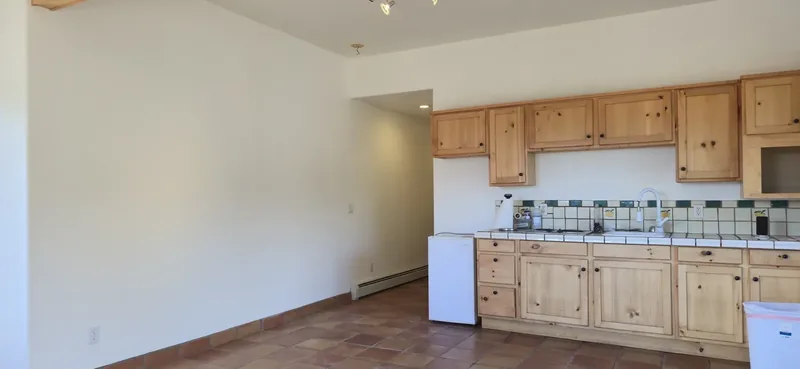 Interior room repainted with clean walls, ceiling, and trim