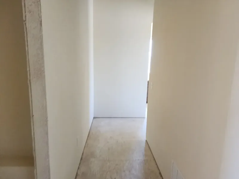 Hallway repainted a clean, bright white