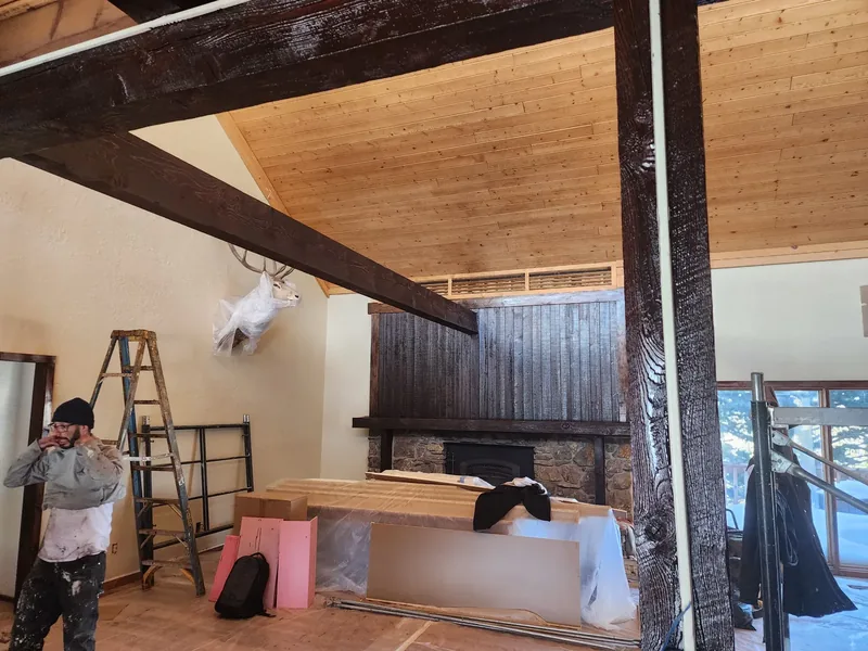 Interior painting in progress with clean-cut edges at the ceiling