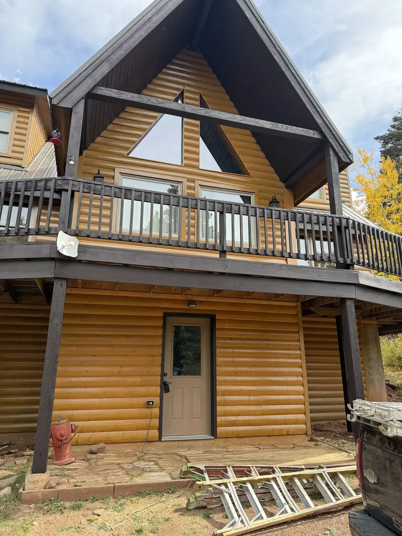 Restored log home with freshly media-blasted and re-stained timber walls