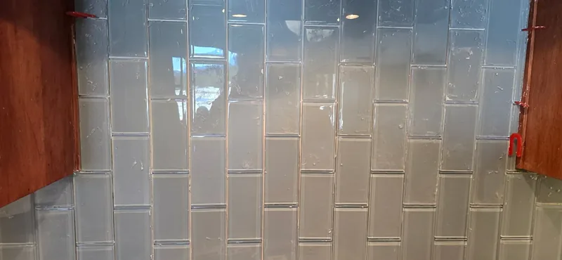 Glass subway tile backsplash finished by SBJ Painting